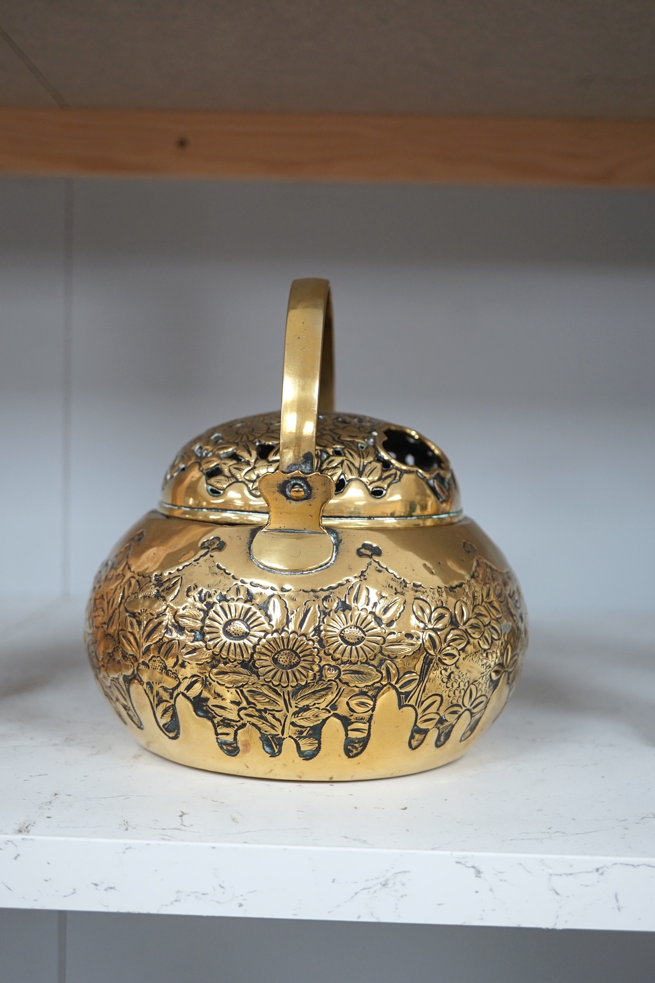 A Chinese brass basket censer and cover, 13cm high. Condition - fair.